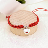 Pulsera trenzada Corazon dentro de un corazón es blanco y rojo