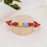 Cord bracelet Color of Ukraine with hearts with yellow and blue enamel